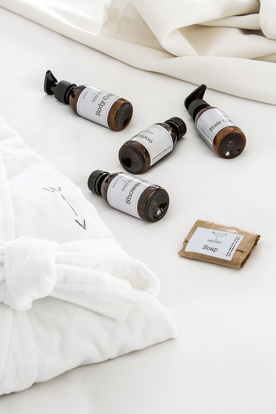 White Villa amenities on the bed