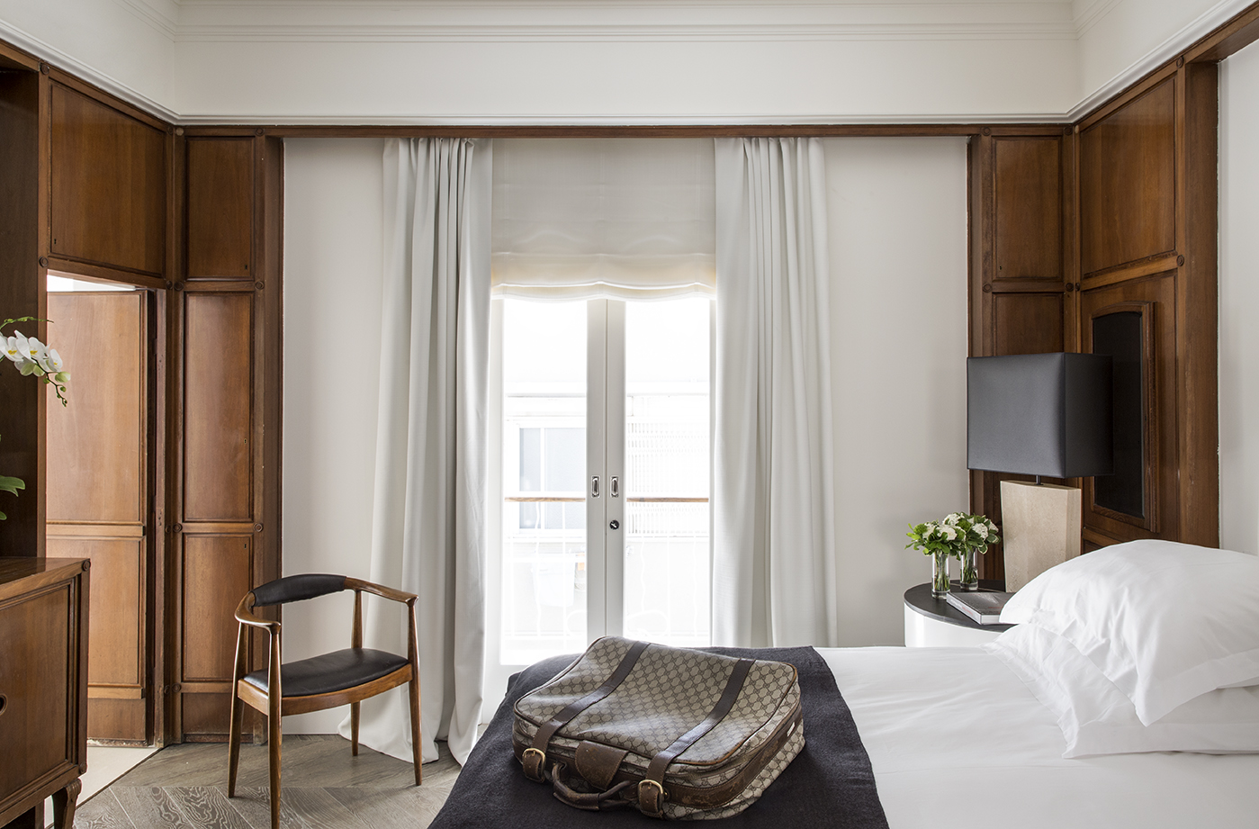 Wood-paneled bedroom